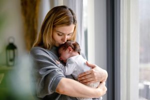 mom holding her baby