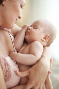 Portrait of a mother with her newborn baby