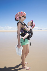 Baby Laughing In Rucksack With Mom