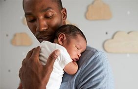 Newborn baby sleeping peacefully while addressing common newborn sleep problems